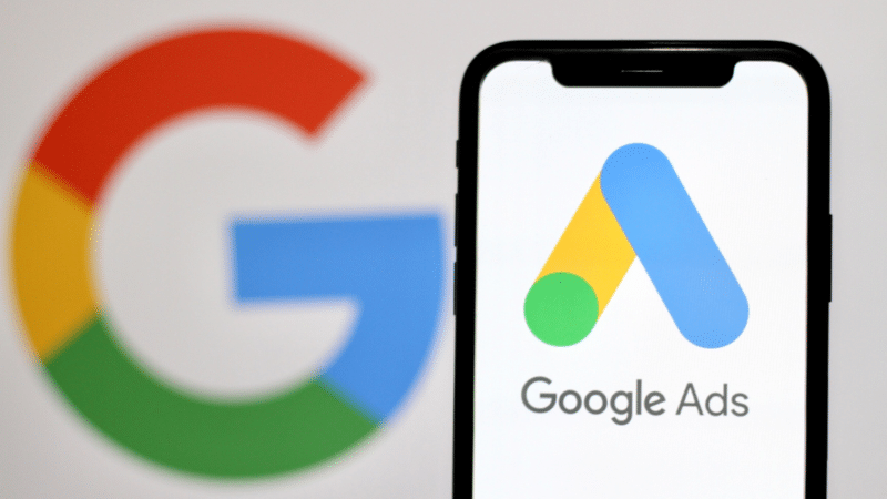 Google logo and Google Ads logo on a smartphone screen.