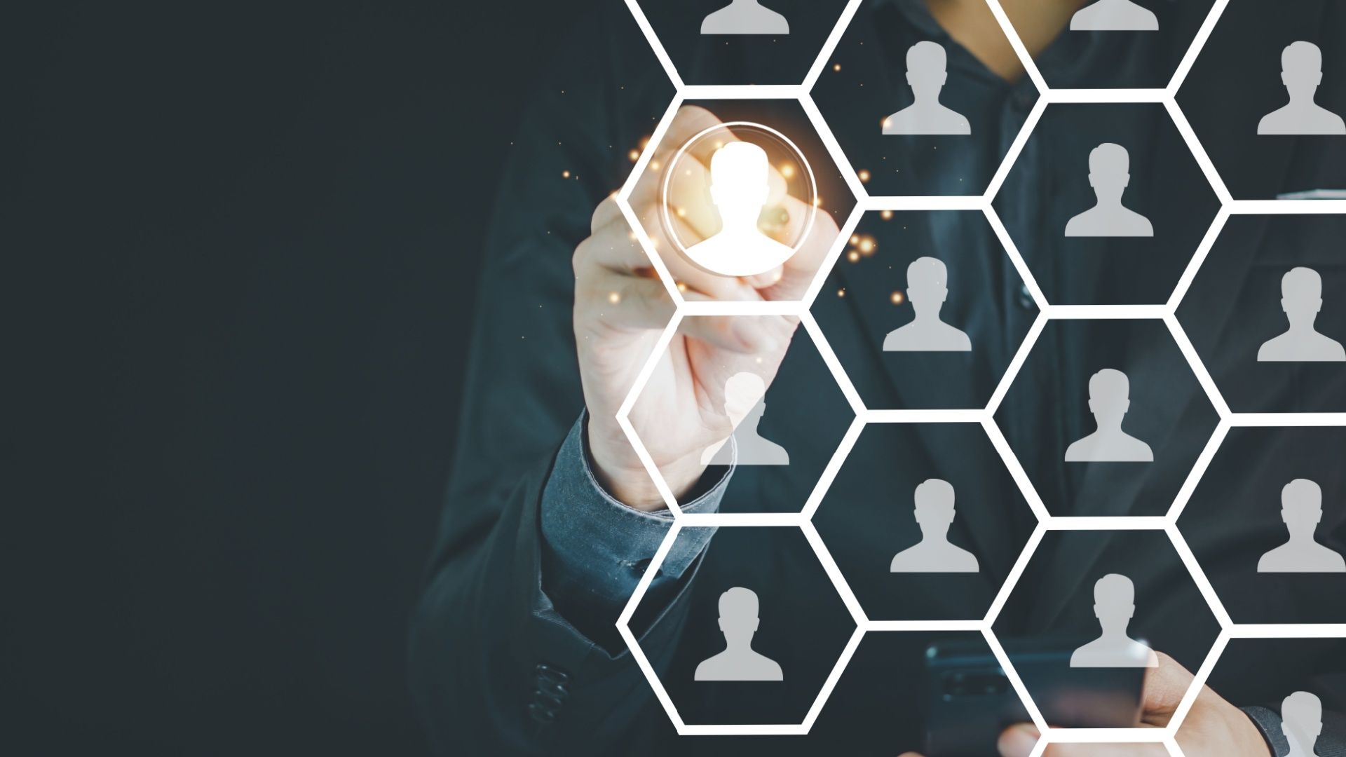 Person selecting a profile icon from a grid of silhouettes, representing talent selection or recruitment.