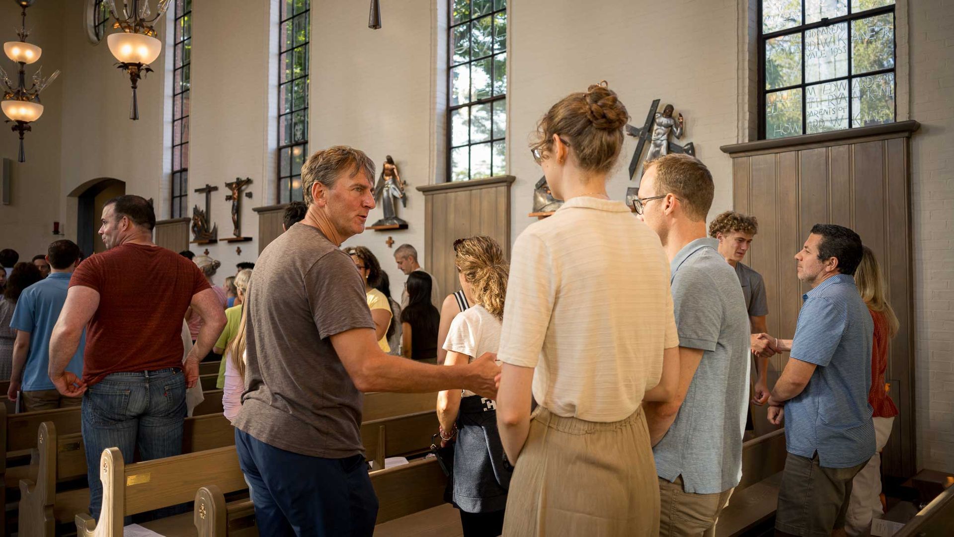 parents and people inside the chapel