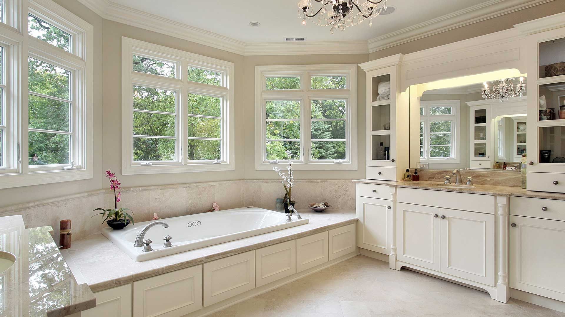 modern bathroom with bath tub and white-painted walls and cabinets