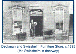 Exterior of Deckman and Swisshelm Furniture Store in 1895. Mr. Swisshelm stands in the doorway.