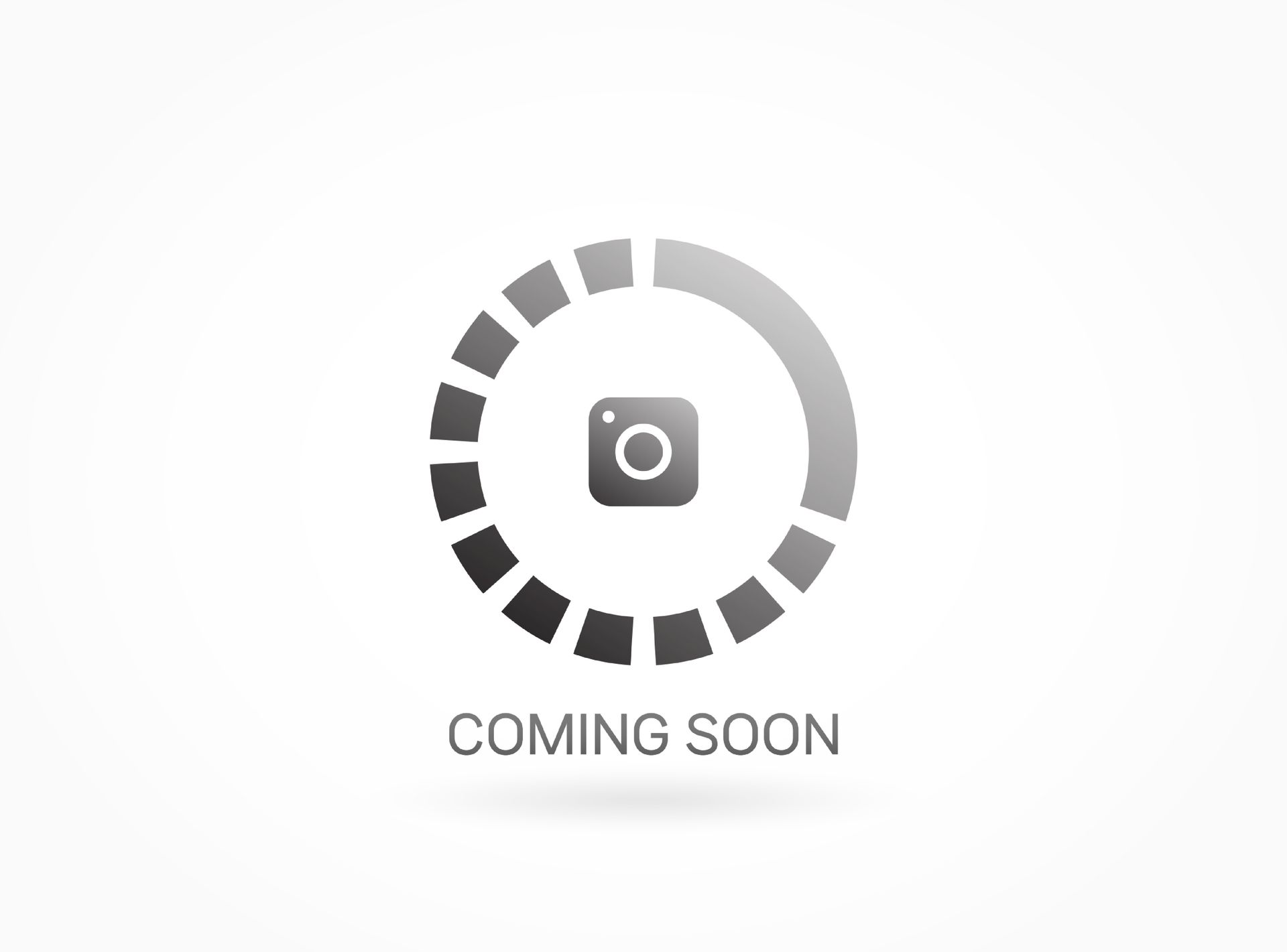 A coming soon sign with a camera in a circle on a white background.