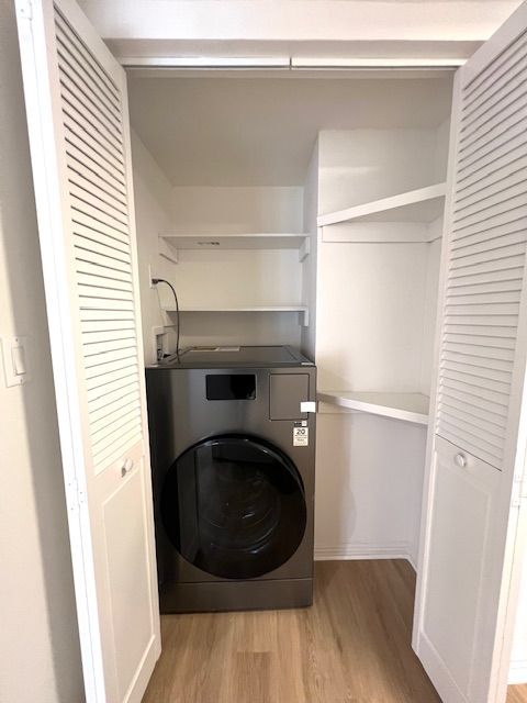 A laundry room with a washer and dryer in a closet.