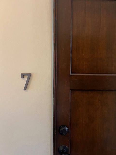 The number 7 is on the wall next to the door.