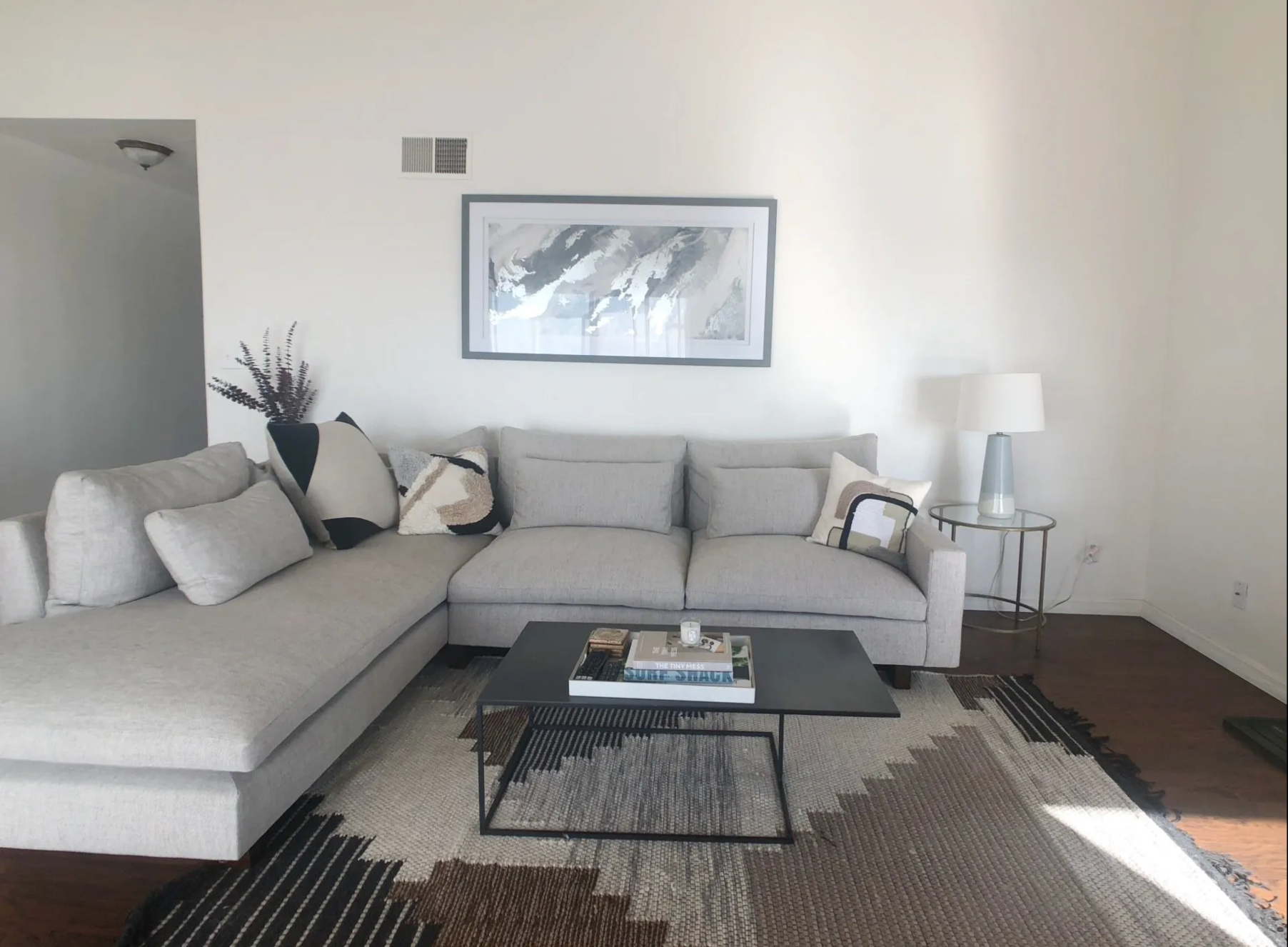 A living room with a couch and a coffee table