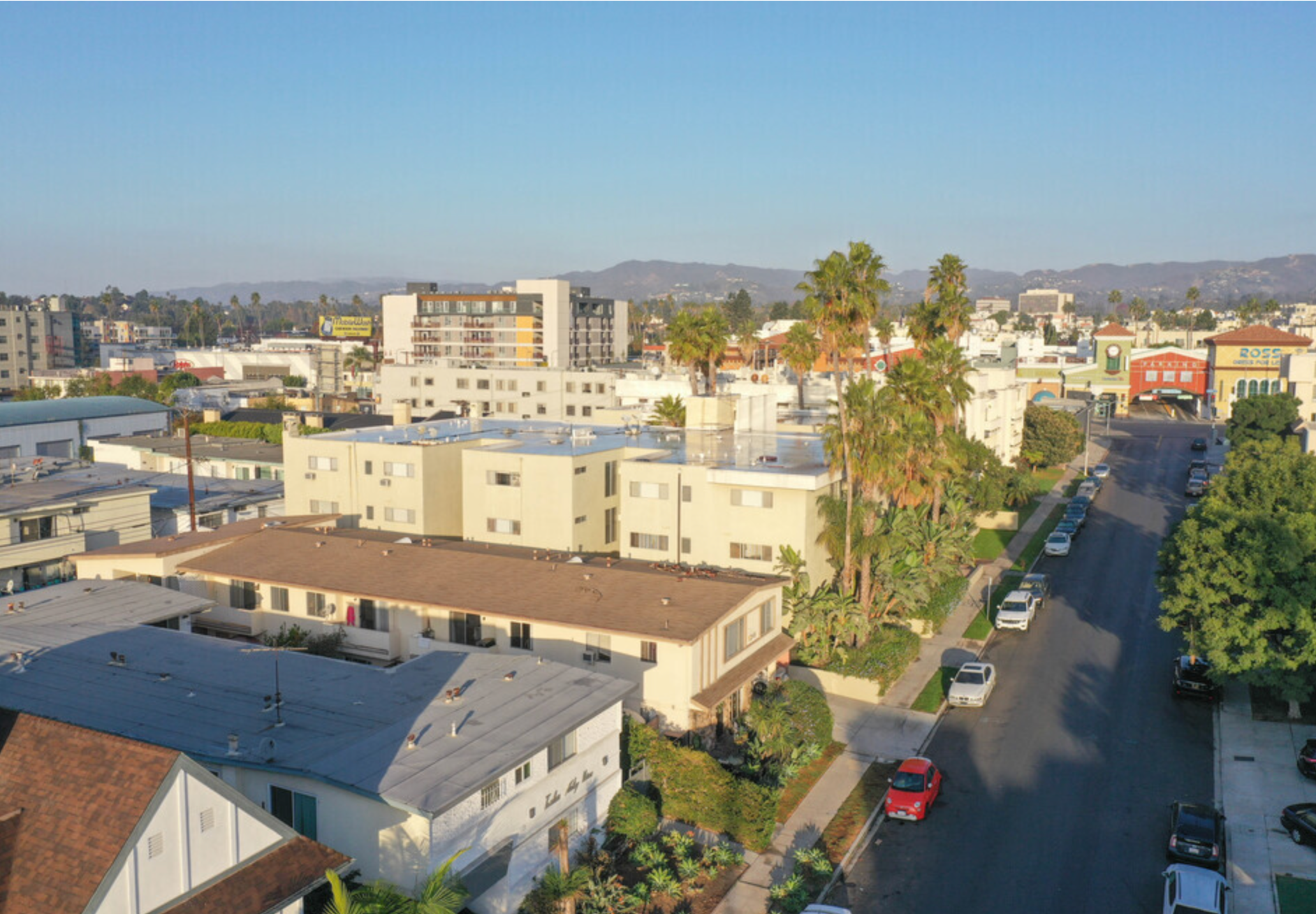 An aerial view of a city with lots of buildings and trees