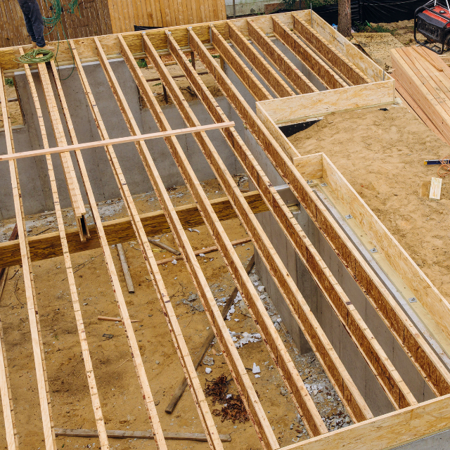 Repairing damaged floor joists in a home