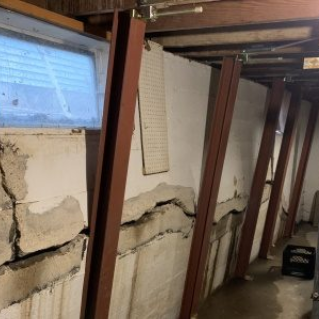 Bowing foundation walls showing structural damage