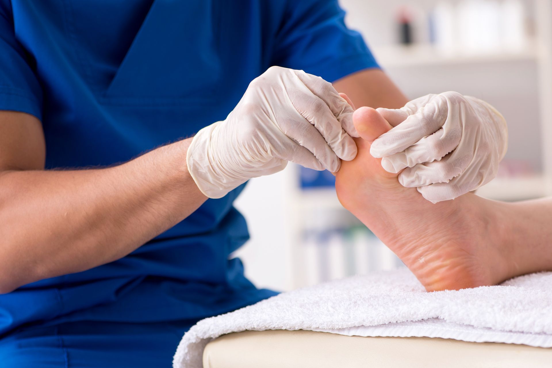 Examining Person's Foot