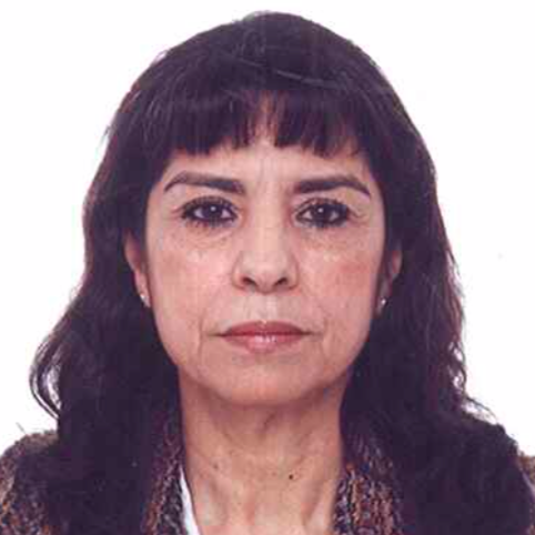Portrait of a woman with dark hair against a plain white background