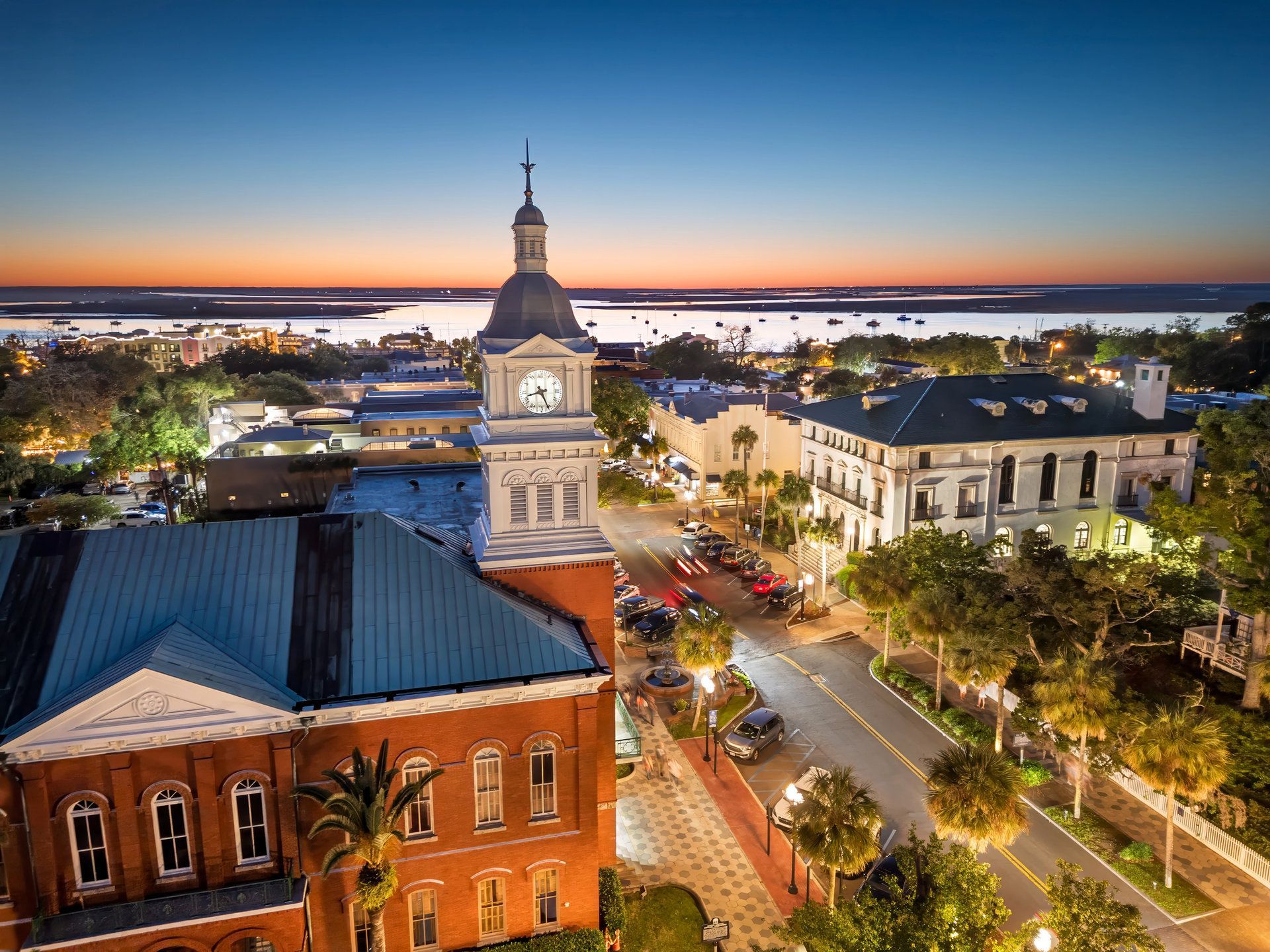 Historic downtown Centre Street at sunset in Fernandina Beach, Florida, with the Amelia River behind