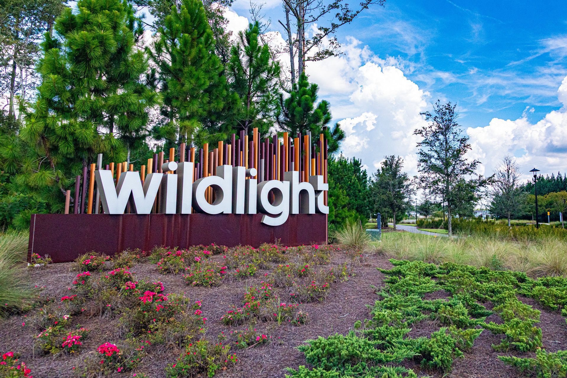 Wildlight community entrance sign surrounded by flowering landscaping in Wildlight,  Florida