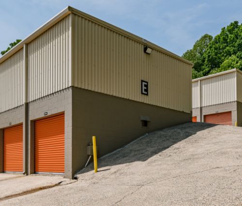 Orange roll-up storage unit doors on a multilevel building at StorMark Self Storage on North Fayetteville Street in Asheboro, North Carolina