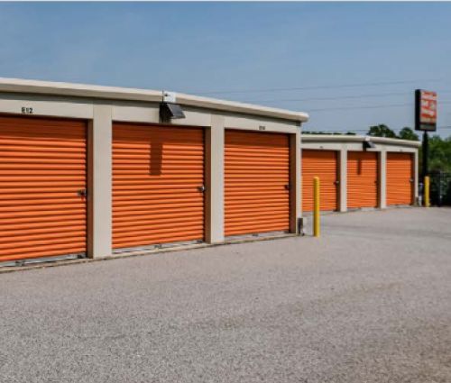 Rows of orange drive-up storage unit doors at StorMark Self Storage on US-64 in Asheboro, North Carolina
