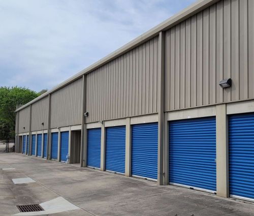 Blue drive-up storage unit doors at StorMark Self Storage on South Industrial Drive in Newnan, Georgia