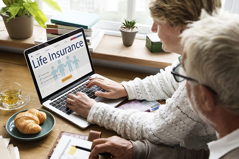 Elderly Couple Using Laptop