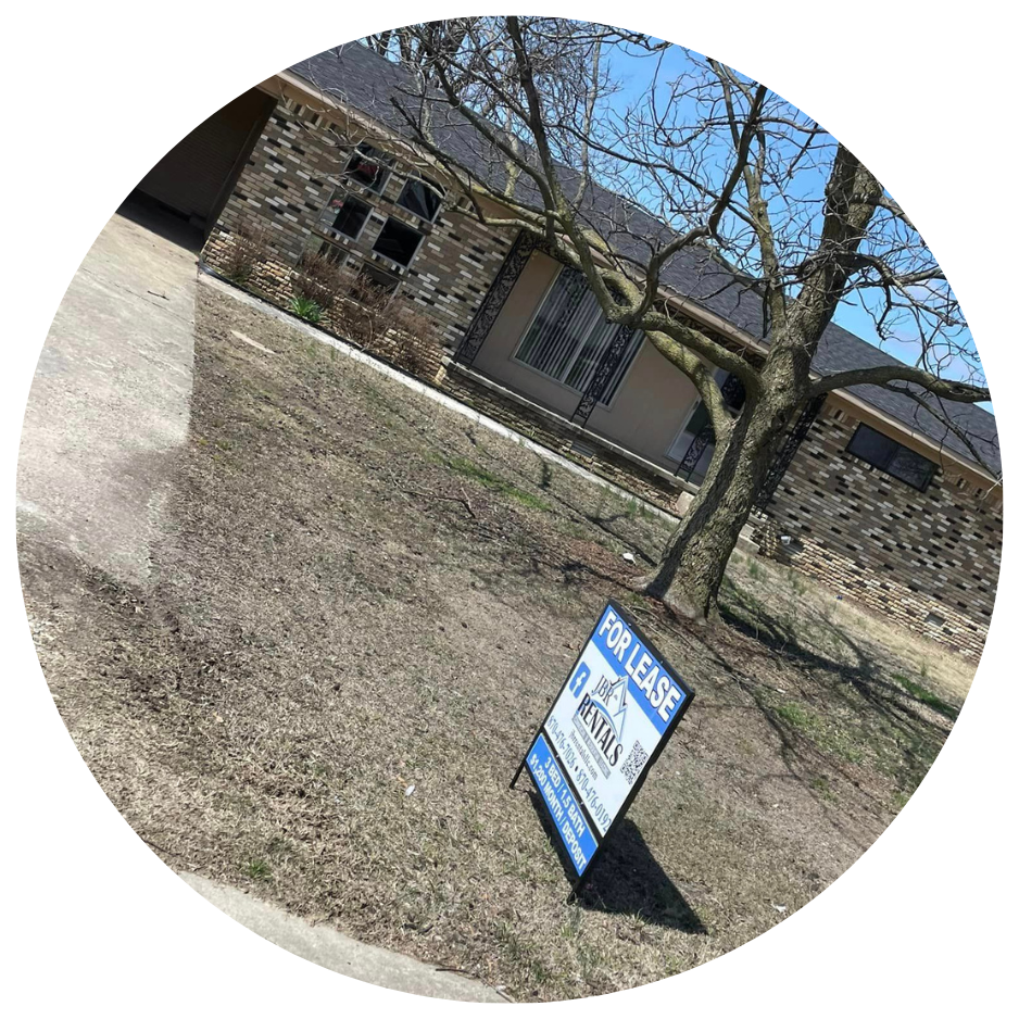 for lease sign in front of rental property