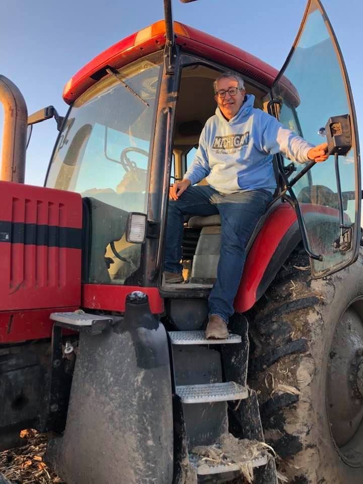 Roger on farm equipment