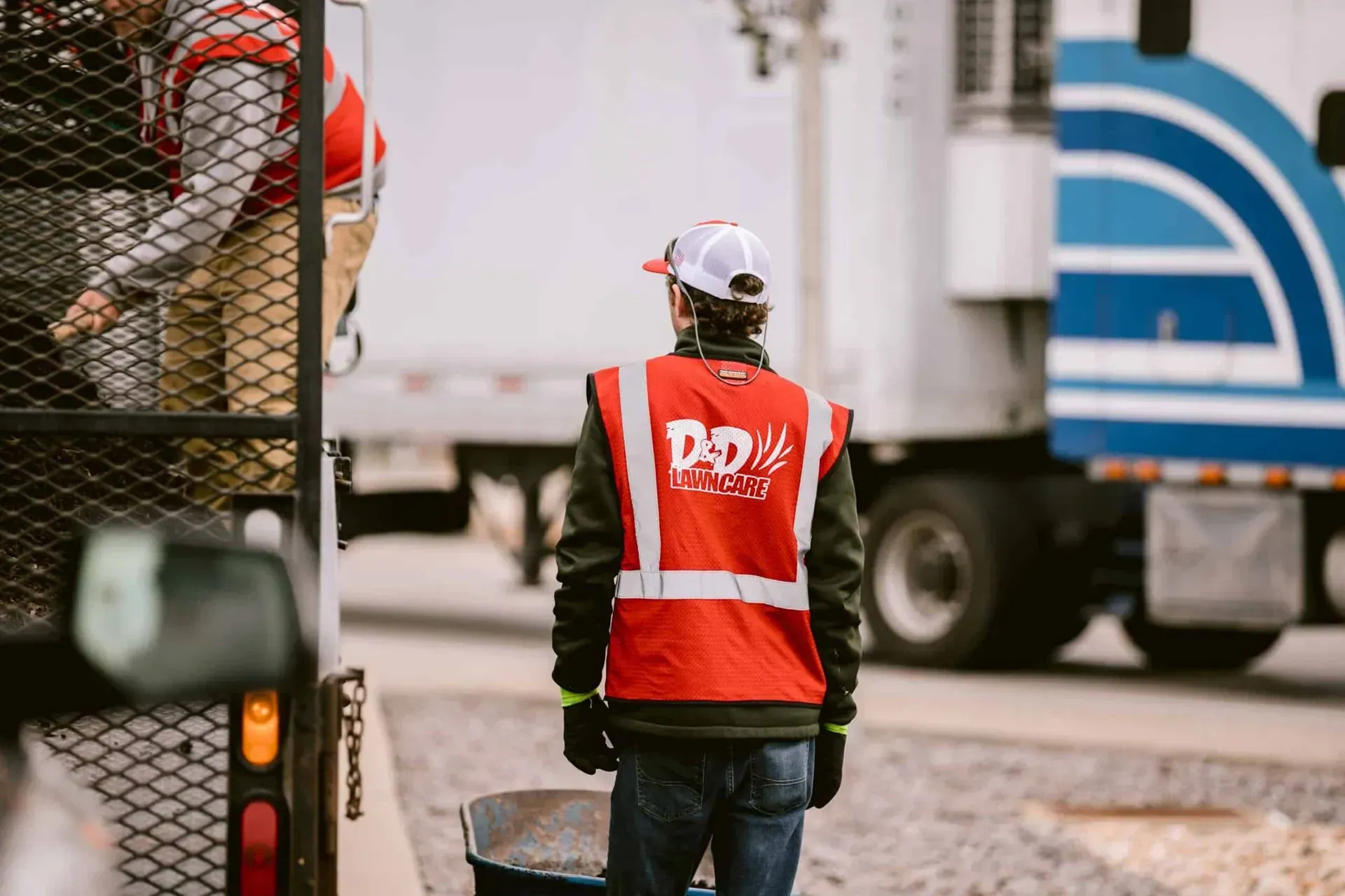Worker in a red vest with 