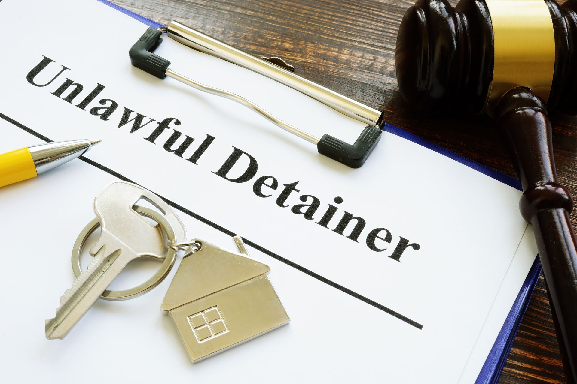Unlawful detainer papers, key and gavel Unlawful detainer papers, key and gavel