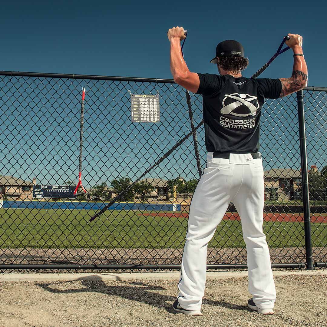 Baseball player using Crossover Symmetry individual exercise package