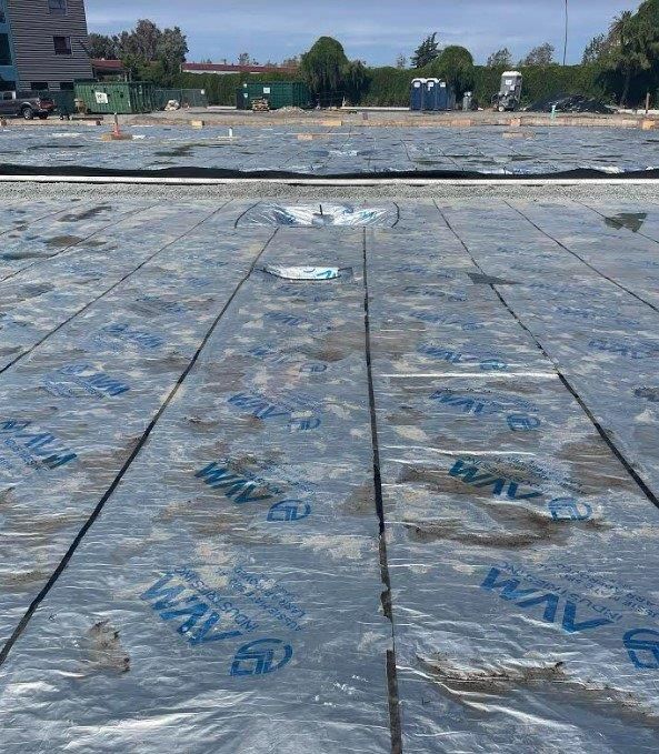 A large amount of plastic is covering a wooden floor. | Oakland, CA | Diablo Roofing