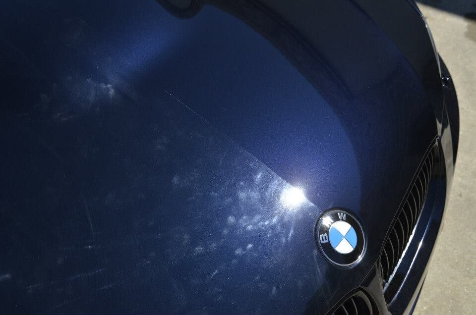 A close up of the hood of a bmw car