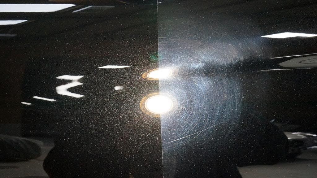 A before and after picture of a car being polished.