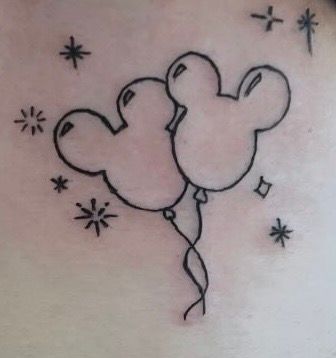 Two connected balloon animals in black line art with starbursts around them