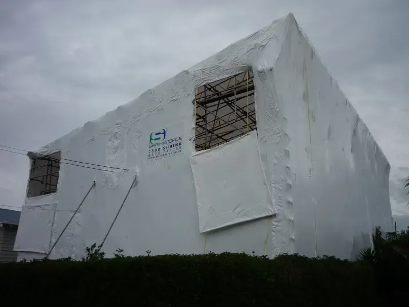 A large encapsulated shrink wrapped scaffold with access holes for materials