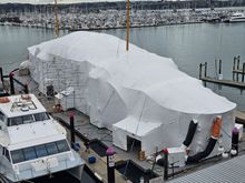 Extensive boat refurbishment requiring large scaffold shrink wrap roof encapsulation floating on the water, 1st time in New Zealand