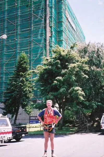 A large scaffold with scrim to protect debris falling and provide protection from the elements