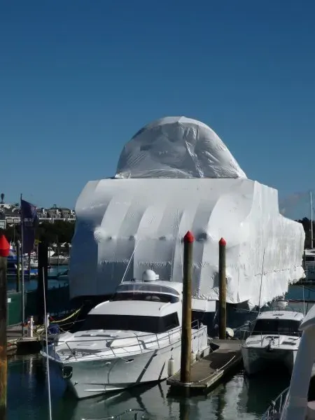 A boat is encapsulated with shrink wrap protecting it form the elements