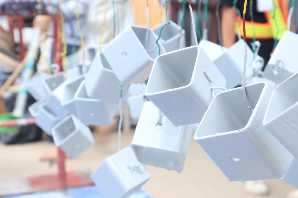 A Bunch of White Squares Are Hanging From a String — Alamo Powder Coaters in Moss Vale, NSW