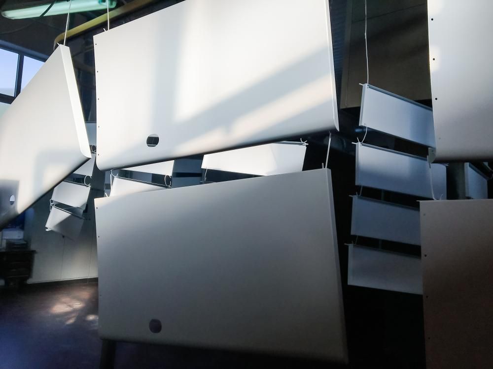A Bunch of White Boxes Are Hanging From the Ceiling — Alamo Powder Coaters in Heathcote, NSW