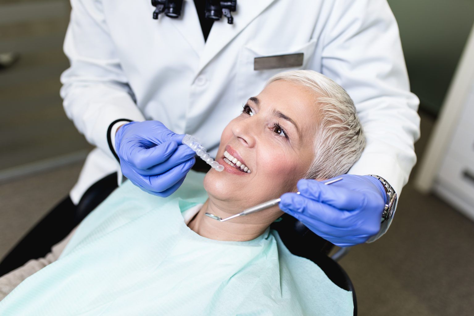 old woman having dental check