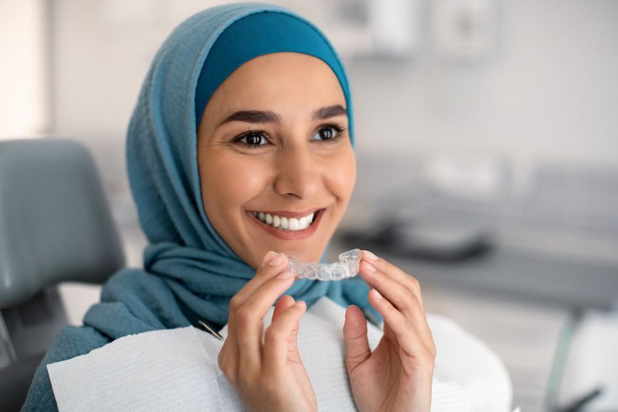 woman smiling | Transform your smile with a clear aligners in Monroe Township, NJ for a confident look.
