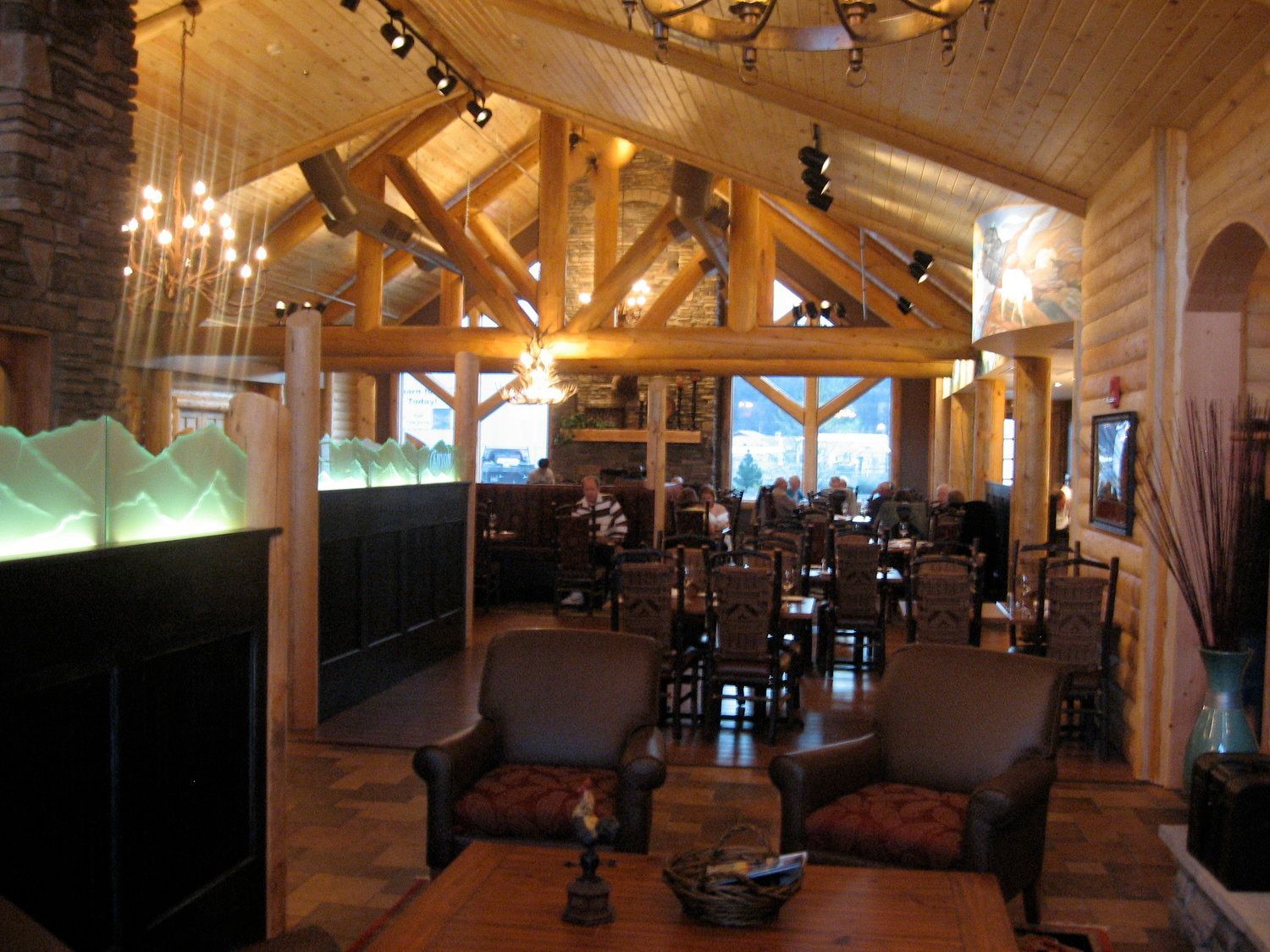 A large room with a lot of furniture and a fireplace