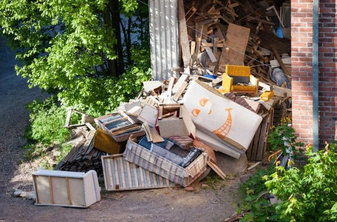 Massive outdoor pile of construction scrap wood and discarded furniture being cleared in Las Vegas b