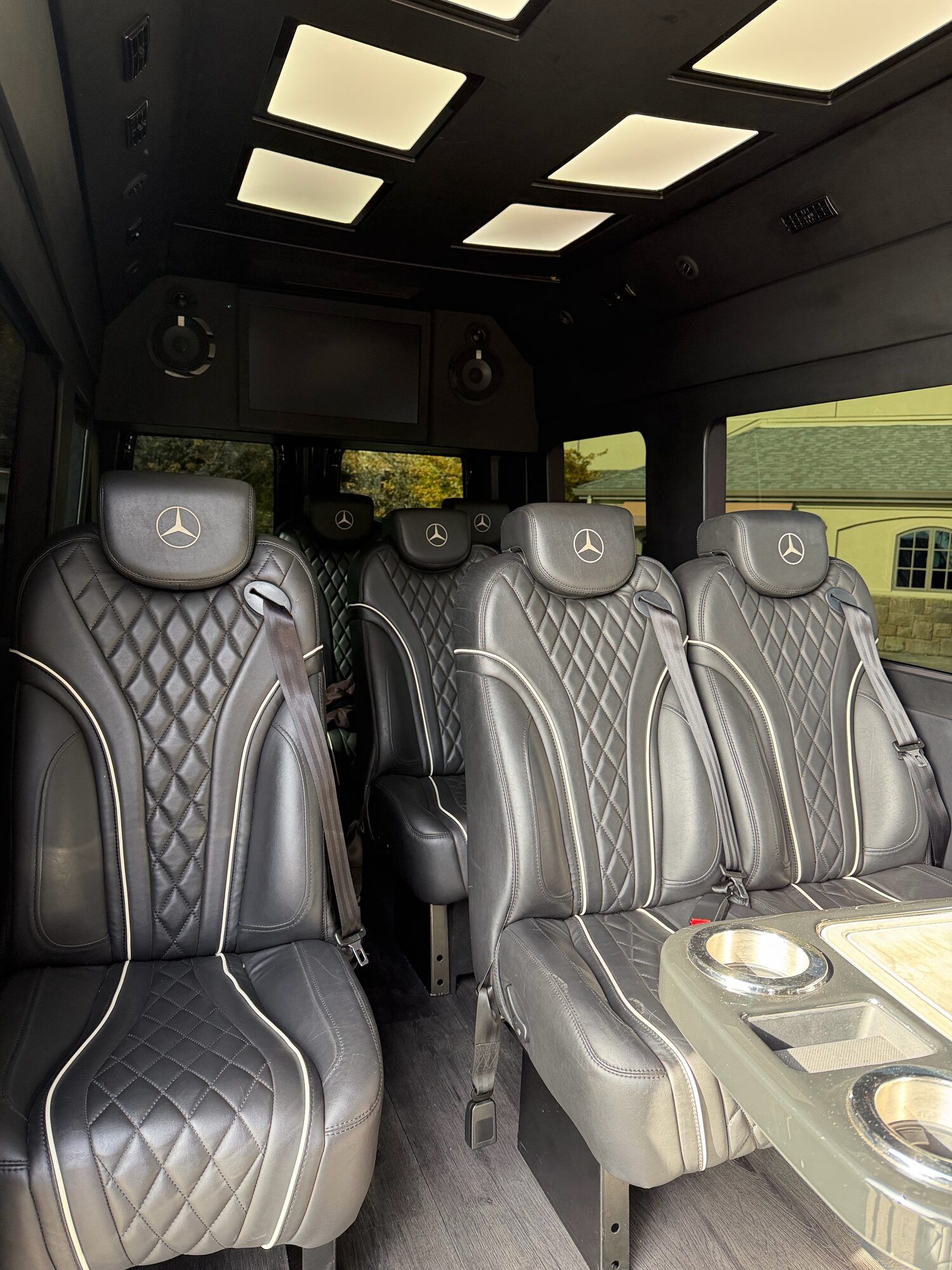 Leather captain's seats and ambient lighting inside the 2024 Mercedes-Benz 12-passenger Executive Sprinter used for Portland limo service