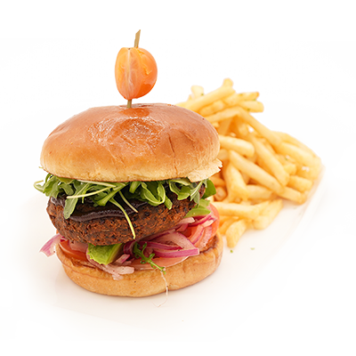 Burger with lettuce and onion, topped with an orange pepper, served with fries on a white background