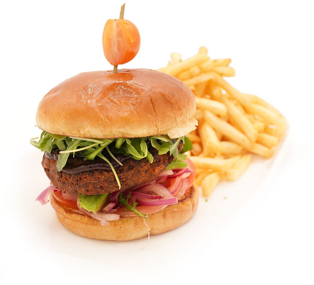Burger with lettuce, onions, and fries, topped with a small orange pepper on a white background