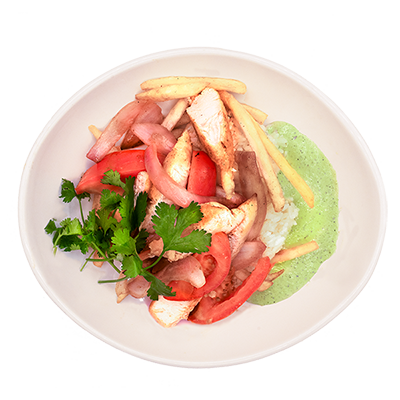 Plate of sliced bread, red tomatoes, herbs, and green sauce arranged in a salad-like dish