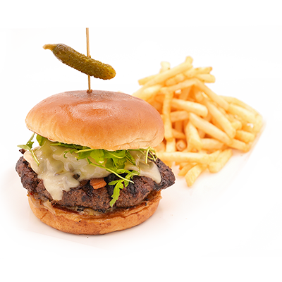 Burger with melted cheese, lettuce, pickle on a bun, served with French fries on a white background