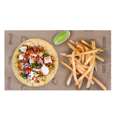 Taco with salsa and lime beside fries on a wooden tray with parchment paper.