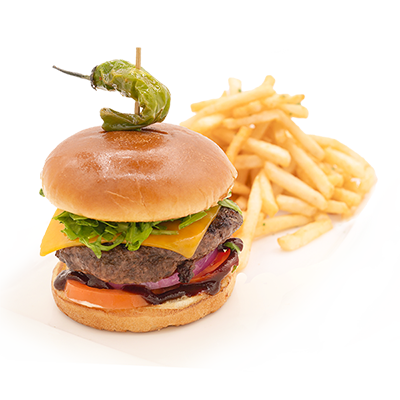 Cheeseburger with fries topped by a green pepper on a white background
