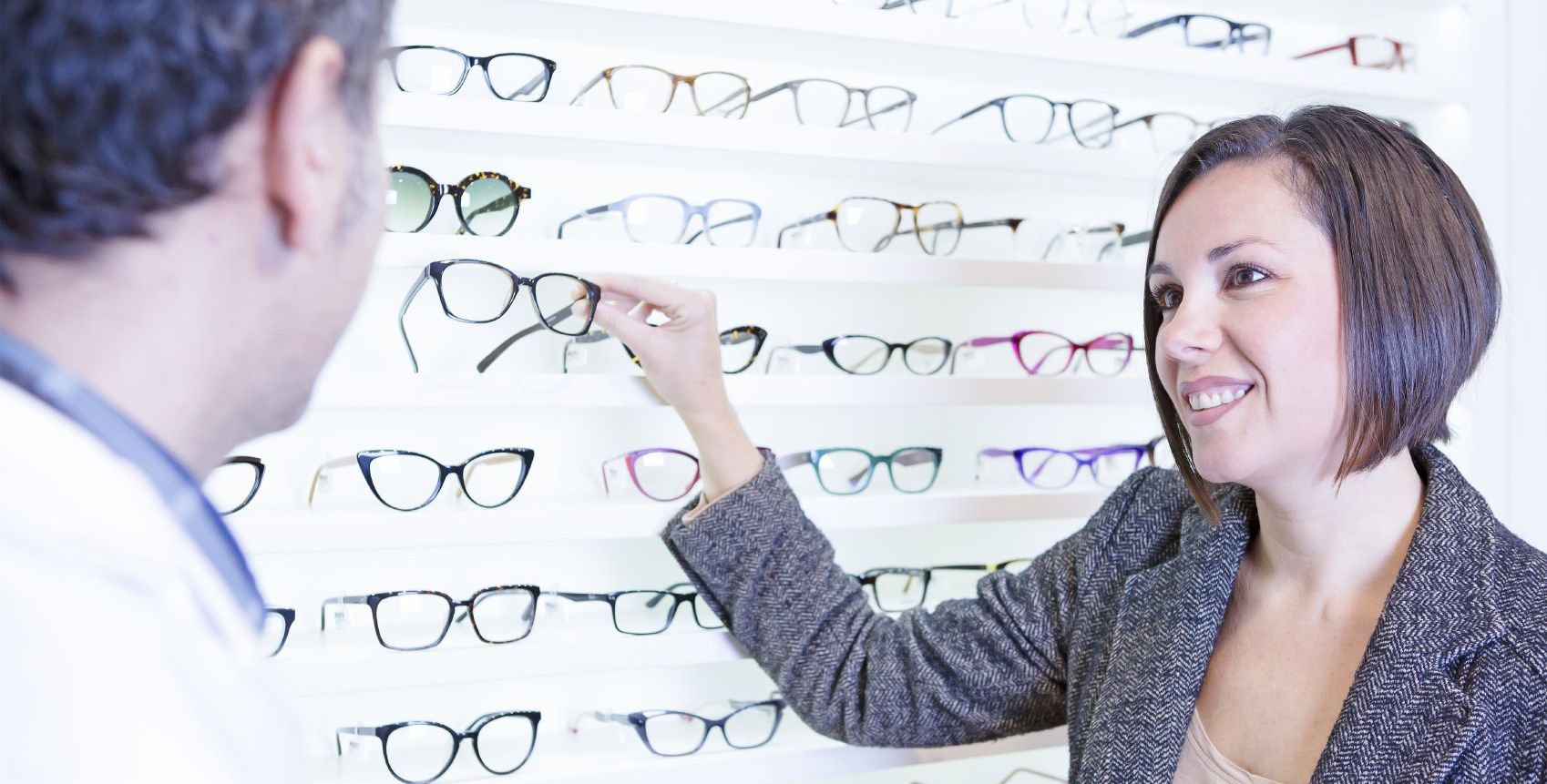 Optician and Client Viewing New Glasses Frames in Buffalo, NY