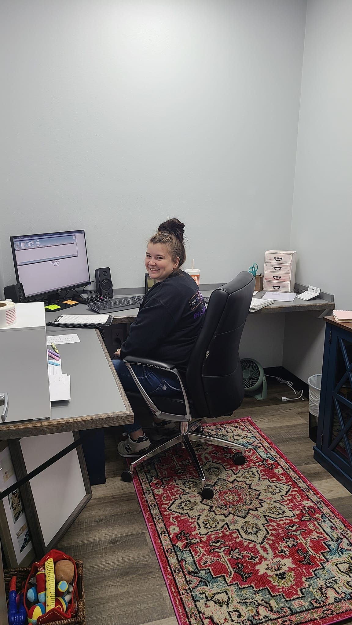 Happy Woman Using Computer — Fort Worth, TX — Auto Glass Xperts