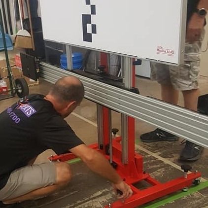 Man Adjusting The Equipment — Fort Worth, TX — Auto Glass Xperts