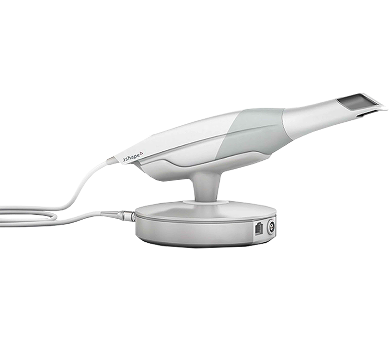 A 3d printer is sitting on top of a charger on a stand.
